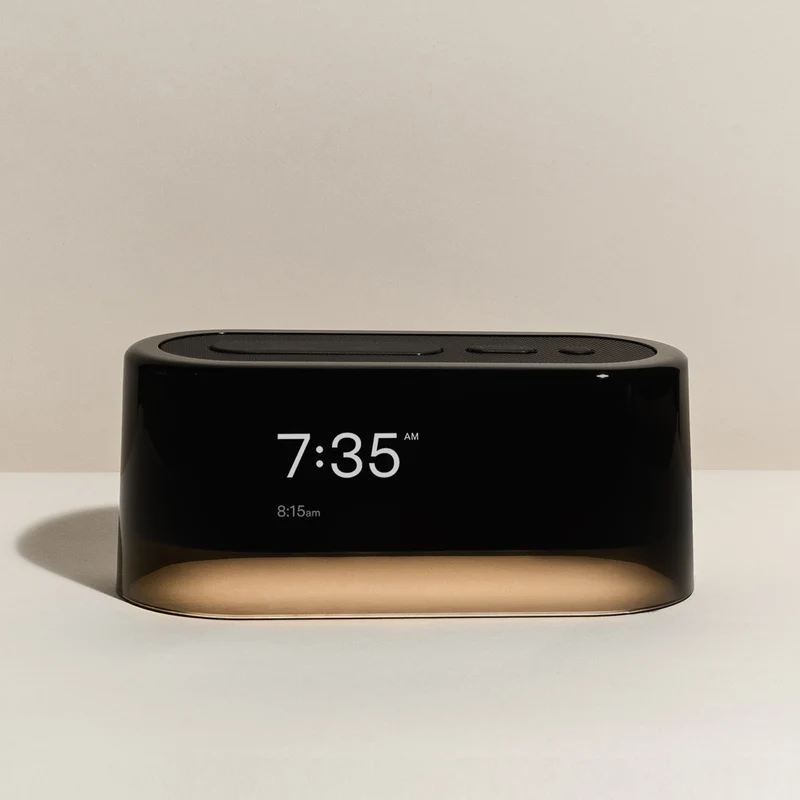 Loftie Clock on a nightstand with dim display and nightlight for a phone-free routine