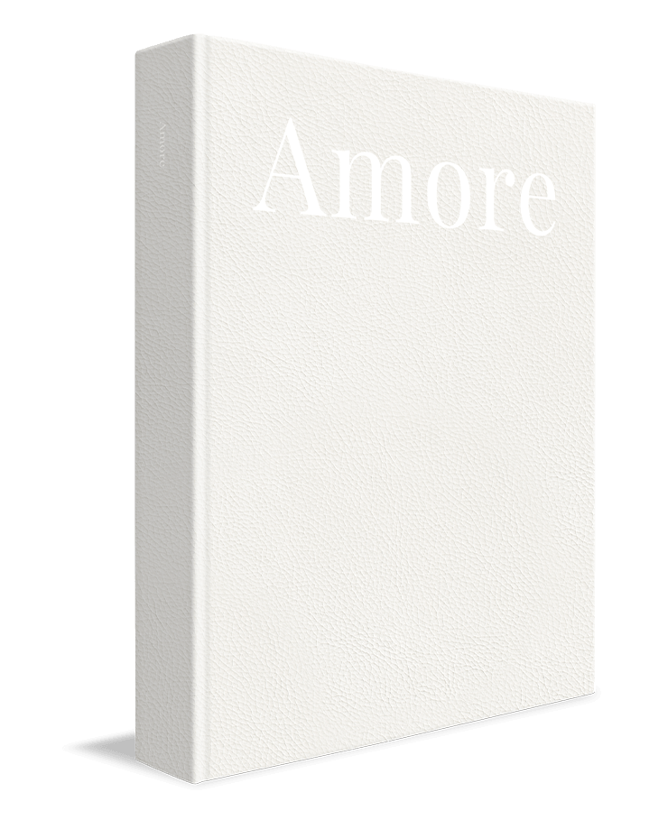 Closed white album from MILK Photo Books with a textured cover and bound spine